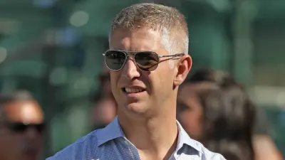 Mike Elias wearing sunglasses