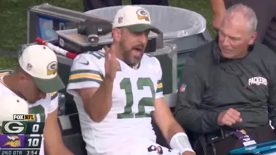 Aaron Rodgers looks frustrated on the sideline