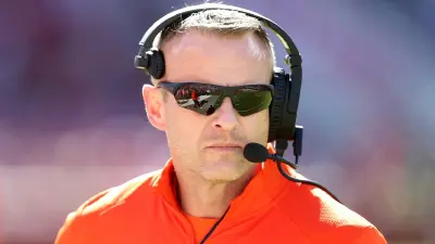Bryan Harsin with a headset on