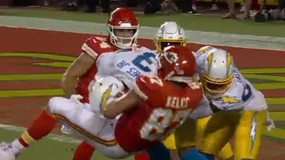 Derwin James slamming Travis Kelce