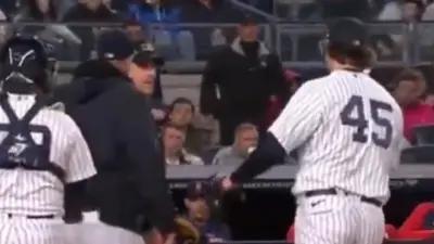 Gerrit Cole looks at the umpire