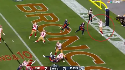 Jimmy Garoppolo standing with a foot in the end zone