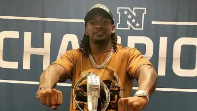Nickell Robey-Coleman posing with a trophy