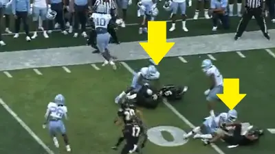 North Carolina players knock down opponents