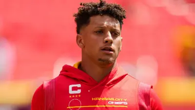 Patrick Mahomes during warmups wearing a Chiefs hoodie