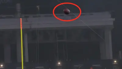 A Mac Jones pass appears to hit a camera wire