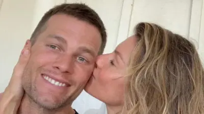 Gisele kisses Tom Brady on the cheek