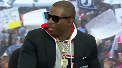Deion Sanders wears a necklace