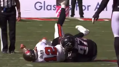 Grady Jarrett tackles Tom Brady
