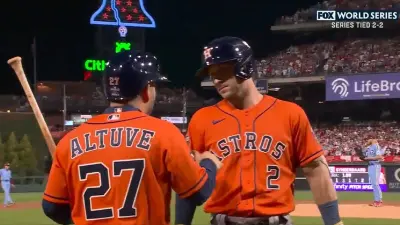 Jose Altuve talks with Alex Bregman