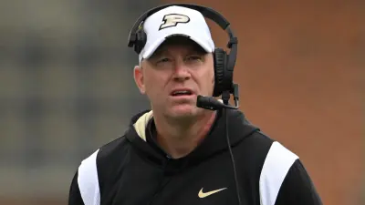 Jeff Brohm wearing a headset