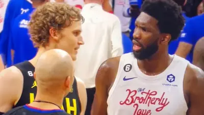 Joel Embiid looks at Lauri Markkanen