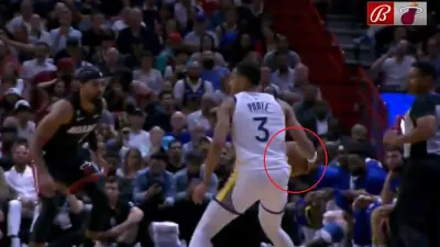 Jordan Poole carries the ball