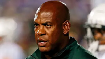 Mel Tucker in a green shirt