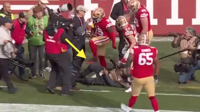 Deebo Samuel stepped over a photographer
