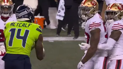 DK Metcalf taunts Dre Greenlaw