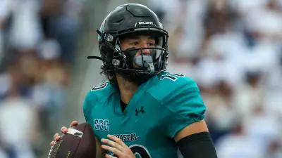 Grayson McCall dropping back to pass