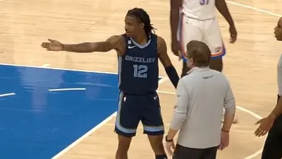 Ja Morant gesturing at a fan