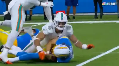 Jaelan Phillips on top of Justin Herbert