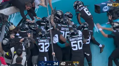 Jaguars players huddle and celebrate