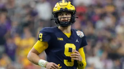 JJ McCarthy in pads and helmet