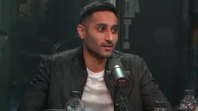 Shams Charania in front of a mic