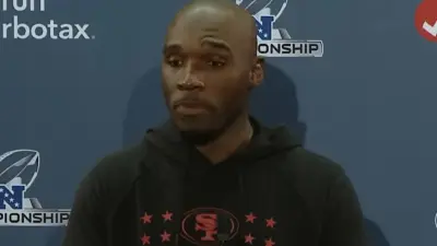 DeMeco Ryans talks with the media