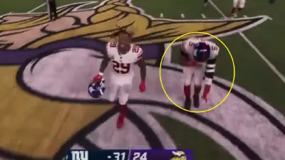 Kayvon Thibodeaux doing the 'Griddy' on the Vikings logo