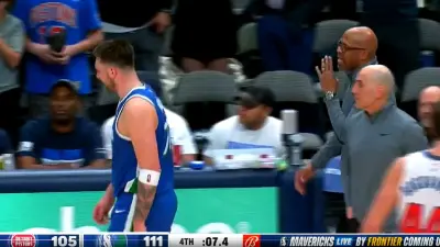 Luka Doncic being talked to by Jerome Allen