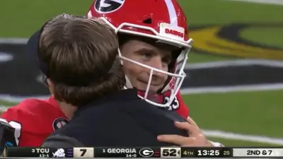 Stetson Bennett hugs Kirby Smart