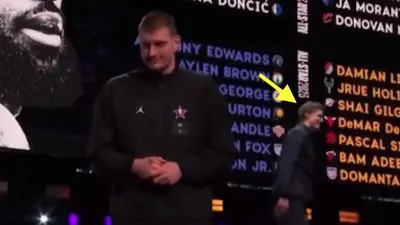 Nikola Jokic walks off stage at the All-Star Game Draft