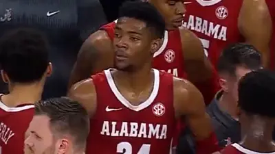 Brandon Miller looks on