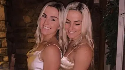 Hanna and Haley Cavinder pose next to each other