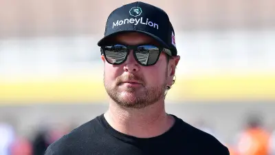 Kurt Busch in a hat and sunglasses