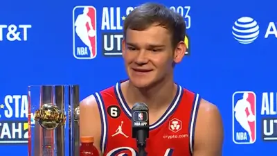 Mac McClung talks with the media