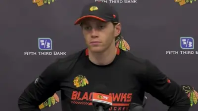 Patrick Kane talks with the media