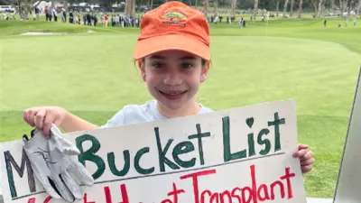 Madelyn Quinn holds up a sign