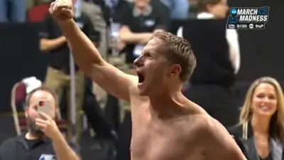 Eric Musselman celebrating shirtless