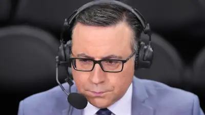 Ian Eagle wearing a headset