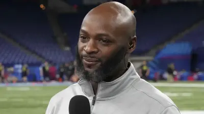 Reggie Wayne holding a microphone