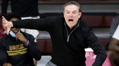 Rick Pitino motions with his hand