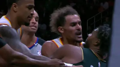 Trae Young and Marcus Smart fighting