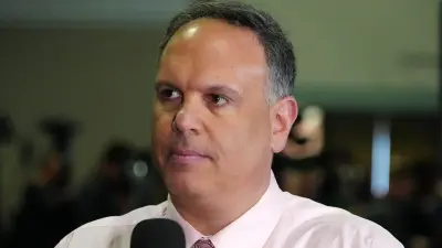 Mike Tannenbaum at the scouting combine
