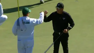 Phil Mickelson gives a high five