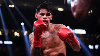 Ryan Garcia holds up his gloves