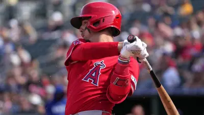 Zach Neto finishes a swing