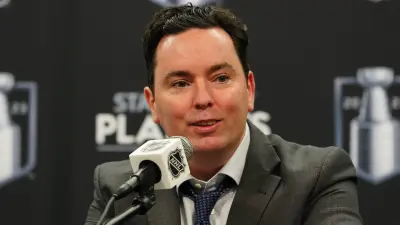 Jay Woodcroft at a press conference