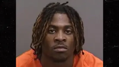 Michel Dukes poses for his mug shot