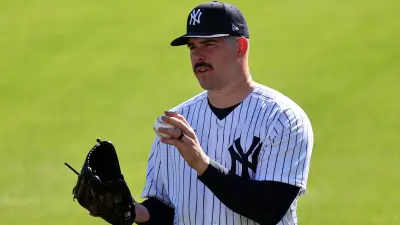 Carlos Rodon holding a ball