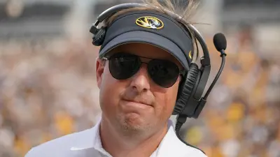 Eli Drinkwitz wearing sunglasses
